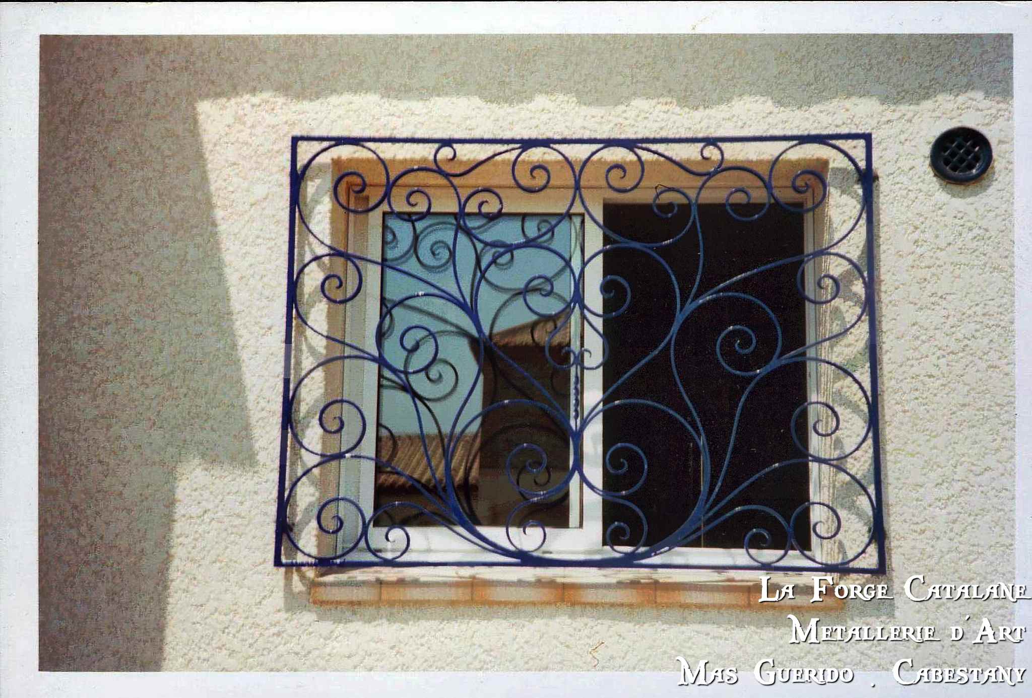 grille defense volutes forge catalane.jpg